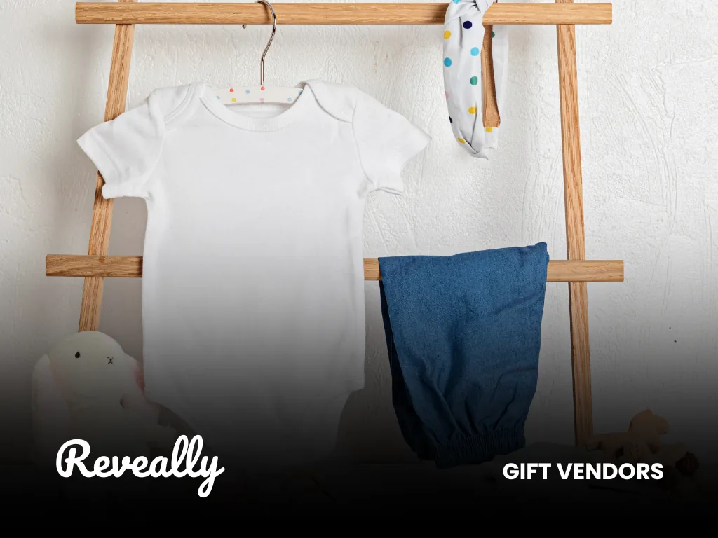 Gender-neutral baby clothes and accessories displayed on a wooden rack
